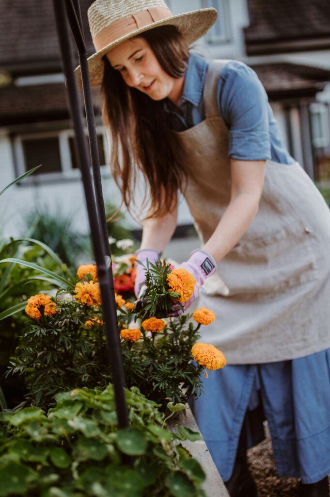 Senior woman gardening with ergonomic tools in her backyard