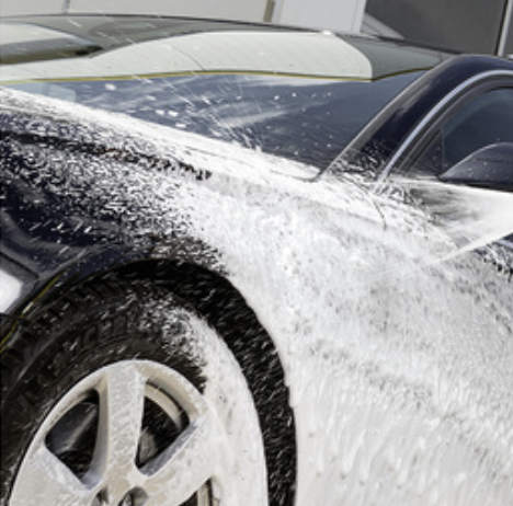 Cleaning car with jet spray from garden hose reel, no bending required
